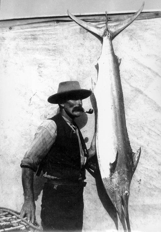 Dr Lidwill's boatman Dick Waterson pictured with the Black Marlin